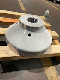 a white metal plate sitting on a pallet in a warehouse